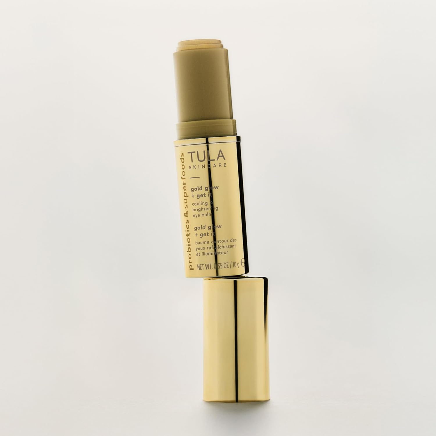 TULA Skin Care Eye Balm Gold Glow - Dark Circle Treatment, Instantly Hydrate and Brighten Undereye Area, Portable and Perfect to Use On-the-go, 0.35 oz.